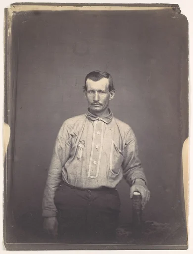 [Man Holding Patent Office Book]