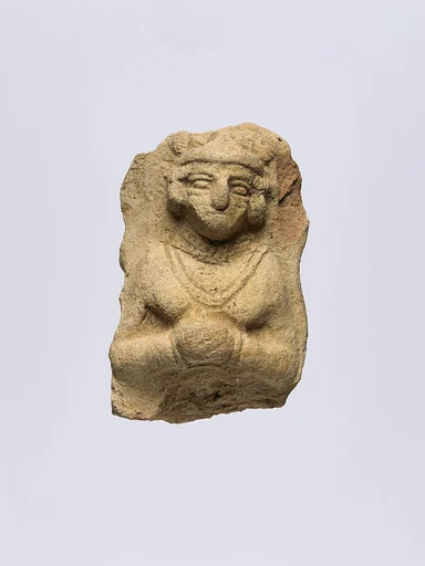 Female figure wearing jewelry