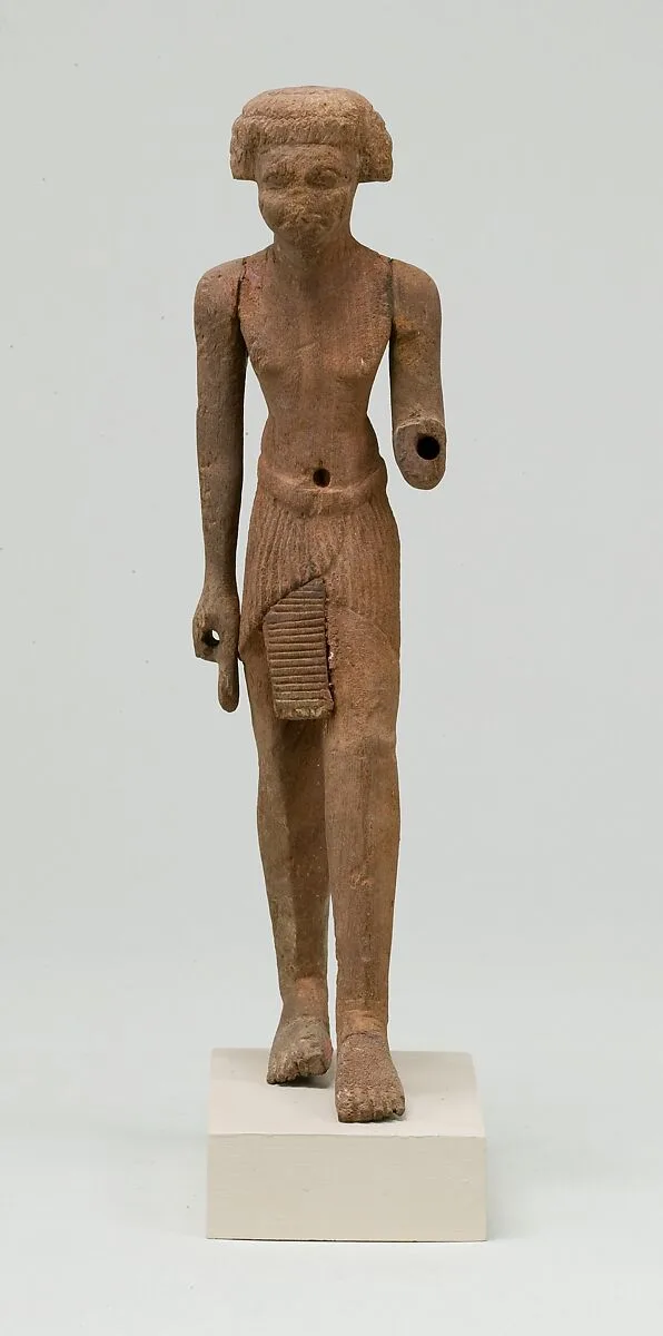 Statuette, striding man — Unknown