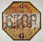 [Rusted Metal Sign: "Stop"]