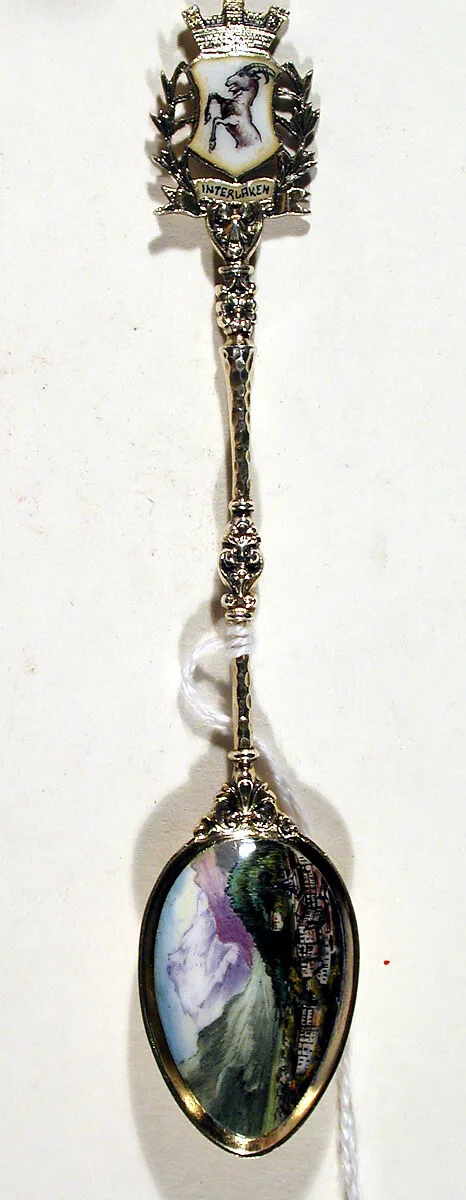 Souvenir spoon with view of town (Interlaken?) surrounded by mountains — Unknown