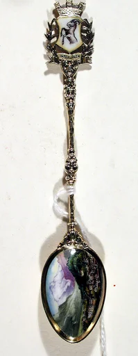 Souvenir spoon with view of town (Interlaken?) surrounded by mountains