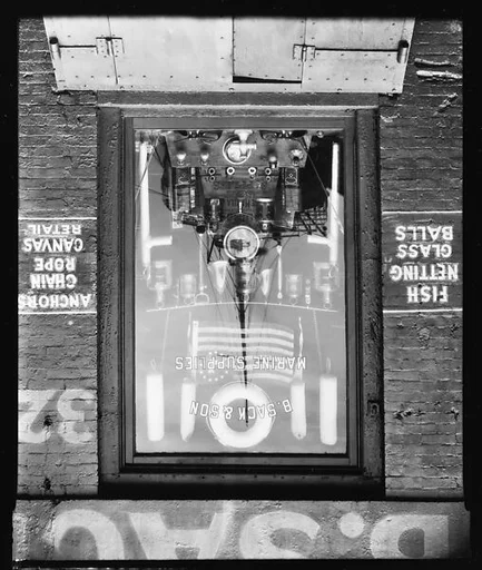 [Boat Reflection in B. Sack & Son Marine Supply Store Window on Waterfront, New York City]