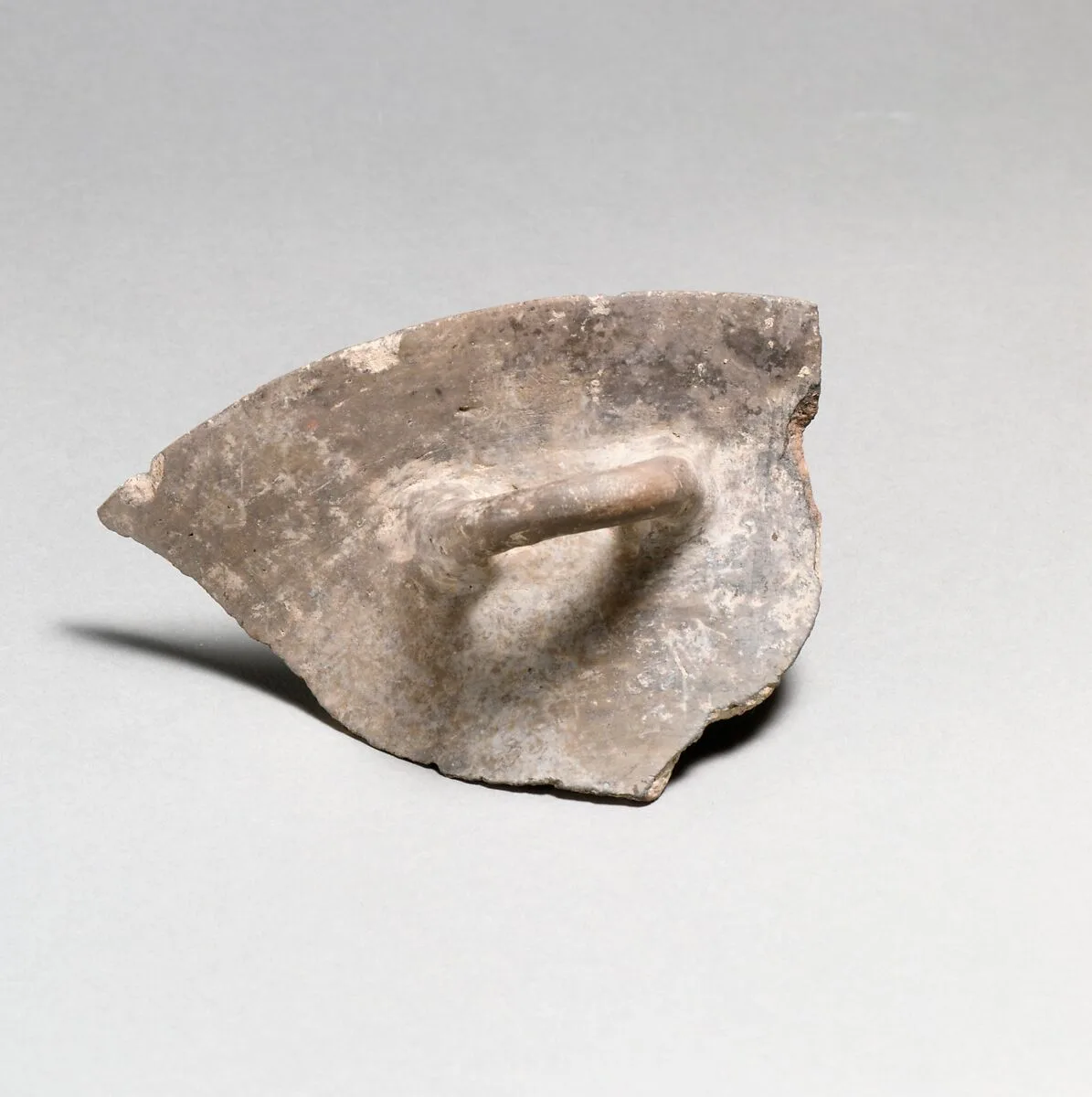 Terracotta rim, handle, and upper body of a bowl — Unknown