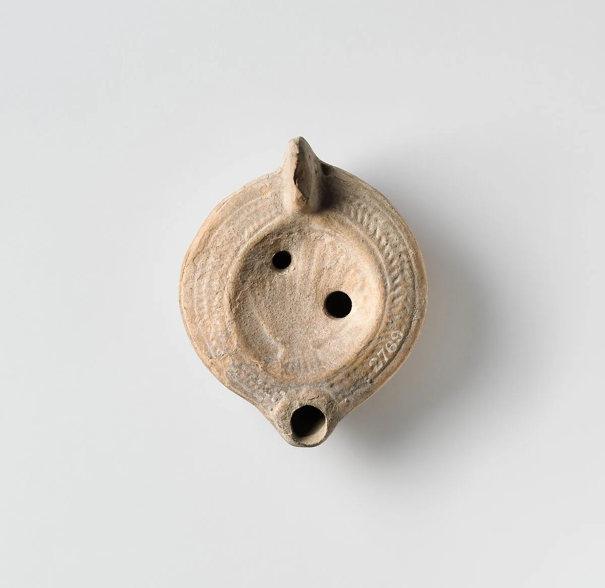 Terracotta oil lamp — Unknown