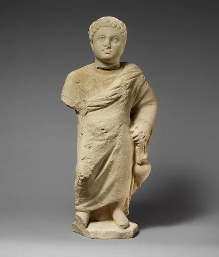 Limestone statuette of a boy holding an amphora