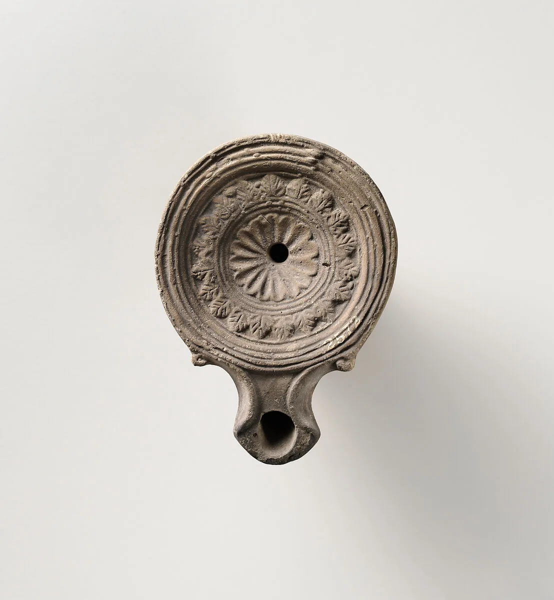 Terracotta oil lamp — Unknown