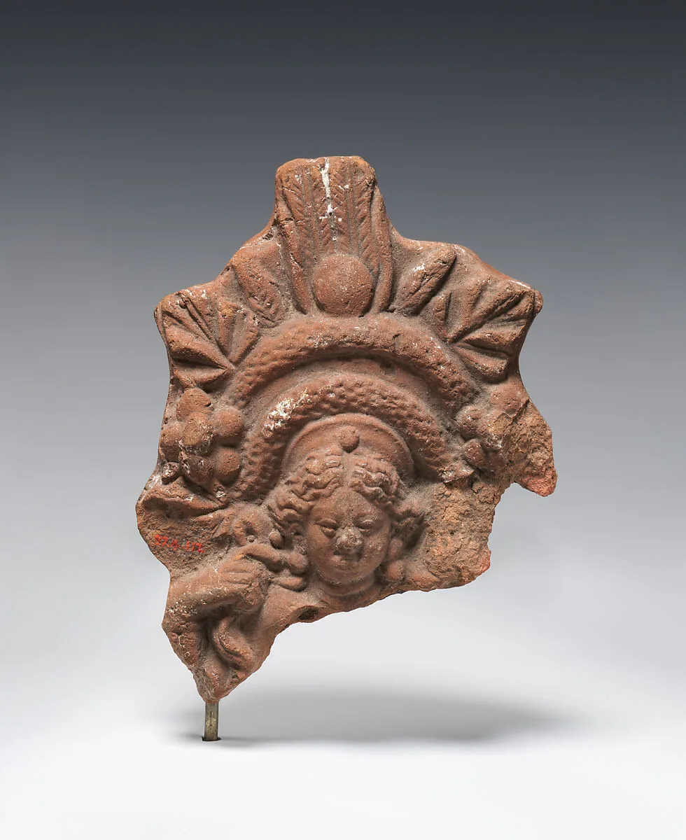 Figurine with elaborate headdress — Unknown