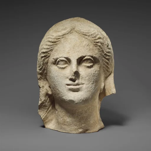 Limestone head of a veiled female votary