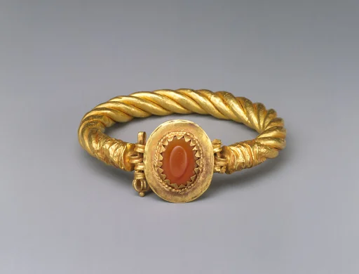 Gold bracelet with a carnelian stone