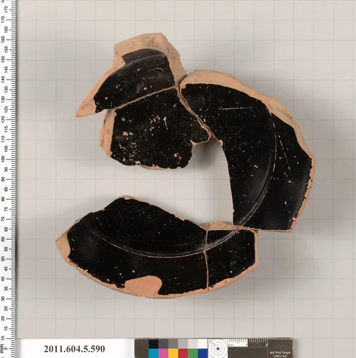Terracotta fragment of a stemless kylix (drinking cup)