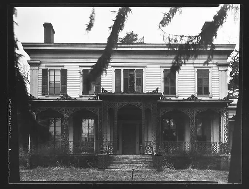 [Greek Revival House with Cast Iron Grillwork on Full-Façade Porch]