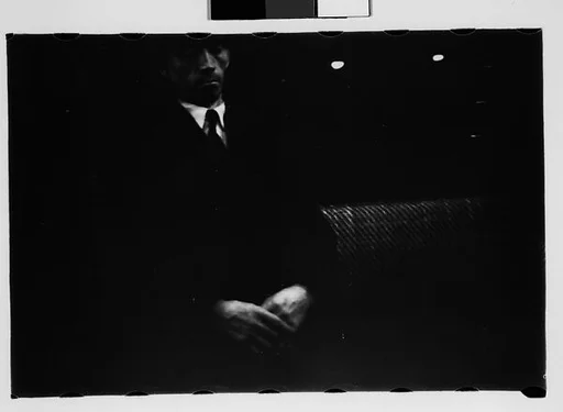 [Five 35mm Film Frames: Subway Passengers, New York City: Man, Man in Hat and Plaid Workcoat]