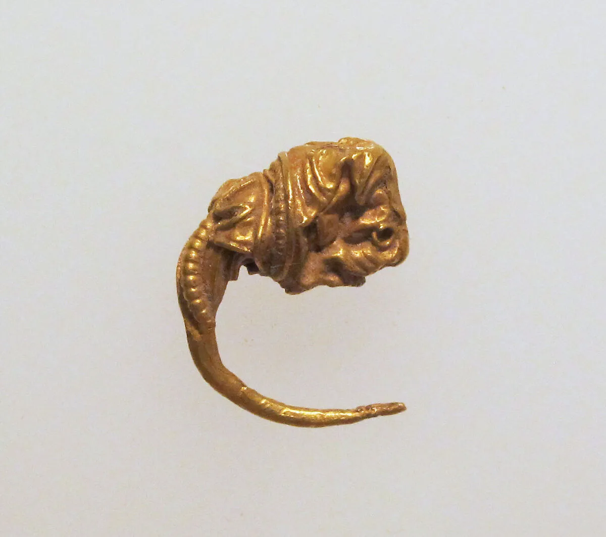 Gold earring with head of a bull — Unknown