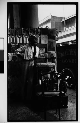 [Young Man in Front of Newspaper Kiosk, Havana]