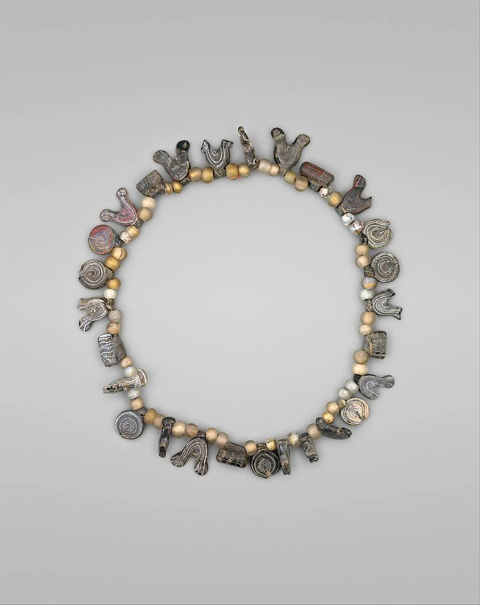 Necklace with Bird, Circle and Cylinder Beads — Unknown