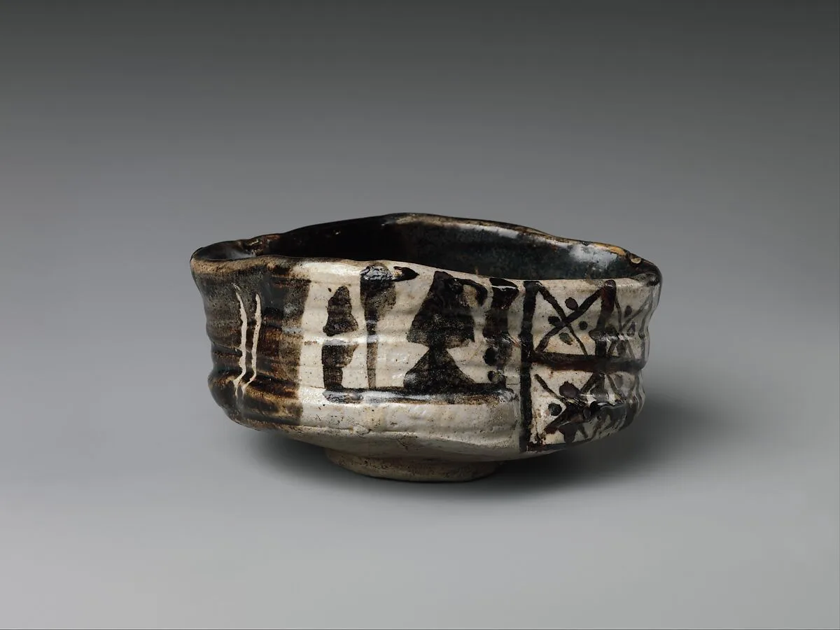 黒織部沓形茶碗|Clog-shaped tea bowl (kutsu-gata chawan) with plum blossoms and geometric patterns — Unknown