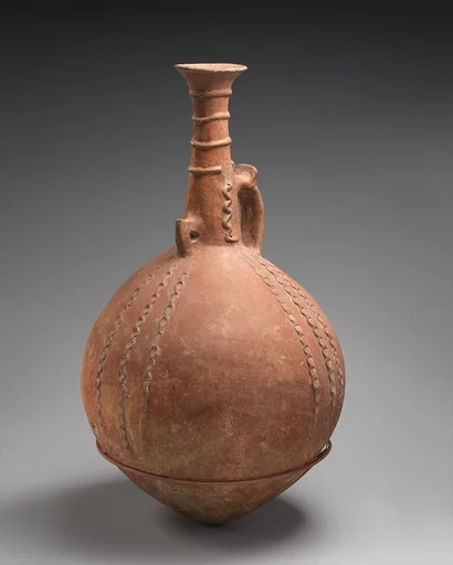 Terracotta jug with relief ornament