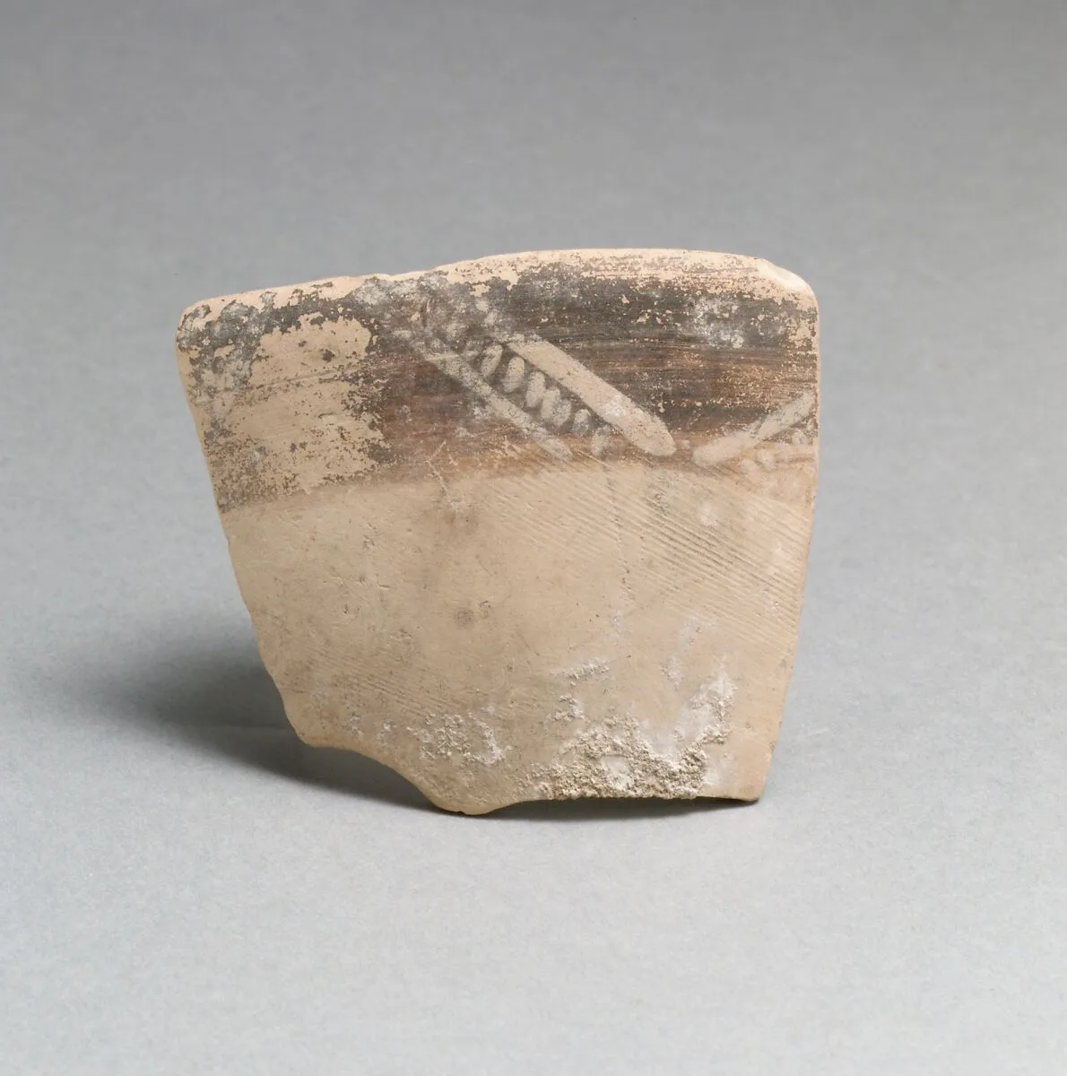 Terracotta rim fragment with diagonal lines and chevrons — Unknown