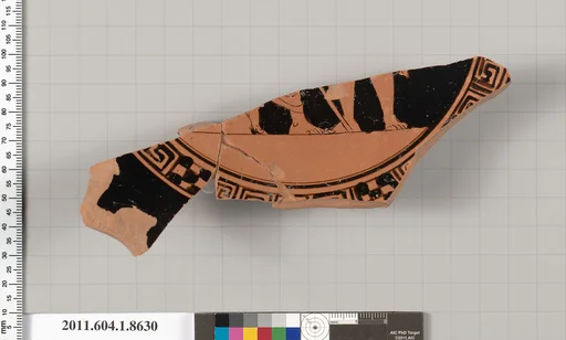 Terracotta fragment of a stemless kylix (drinking cup)