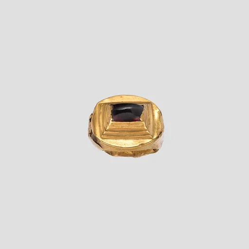 Gold and garnet ring