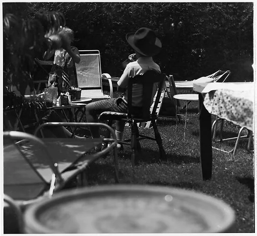 [Girl Standing, Boy in Chair]