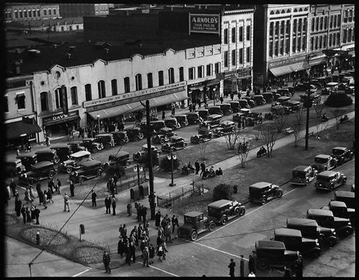 [Stores and Parked Cars on Main Street, From High Elevation, Macon, Georgia]