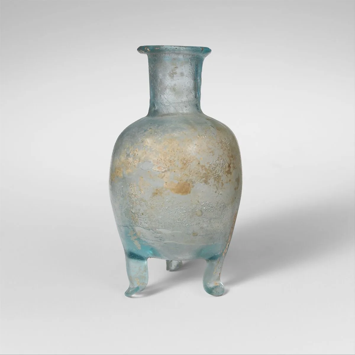 Glass bottle with three feet — Unknown
