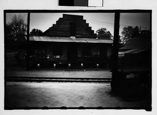 [Woden Buildings by Railroad Tracks, From Train, Savannah, Georgia]