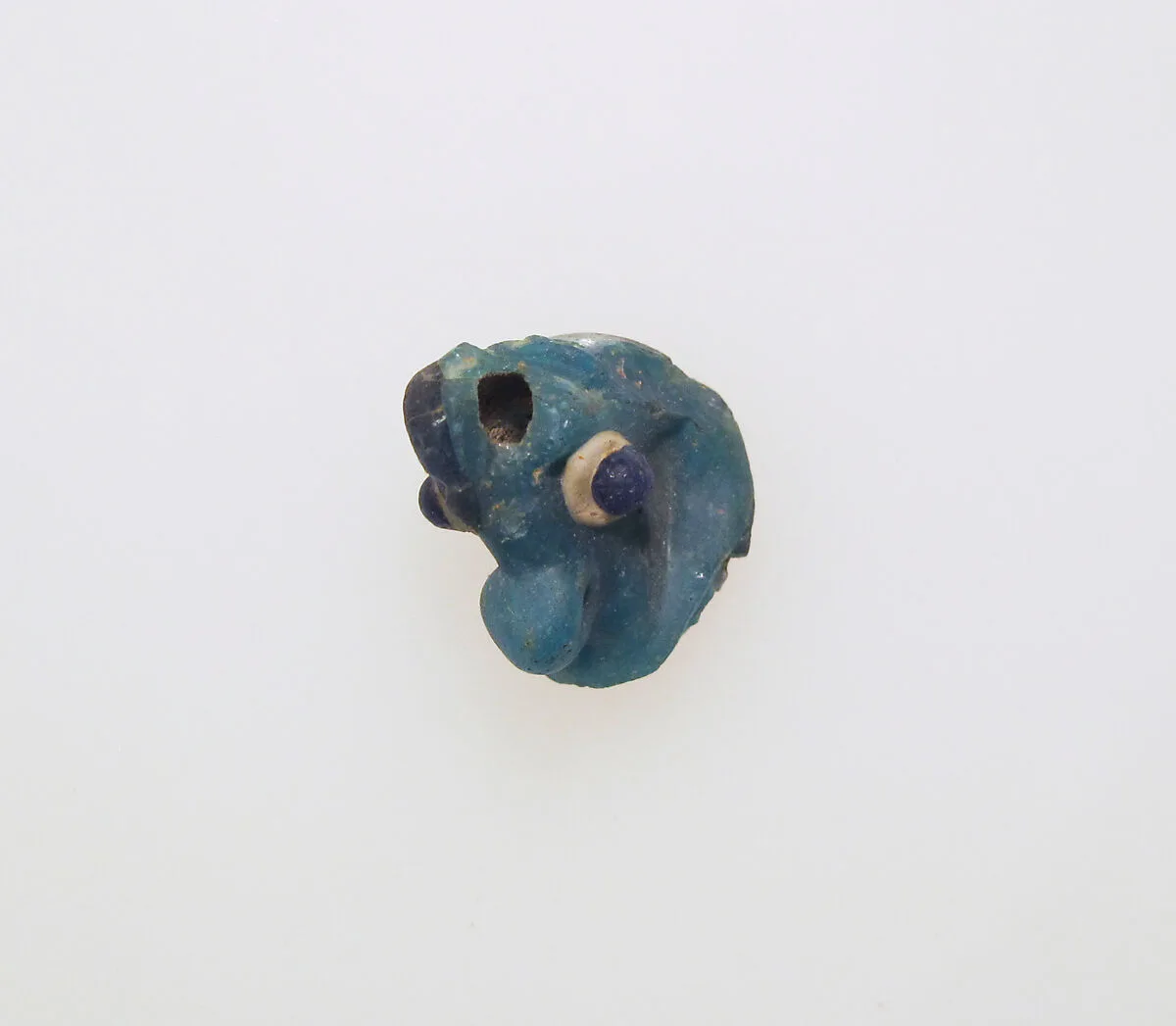 Glass pendant in the form of a demonic mask — Unknown
