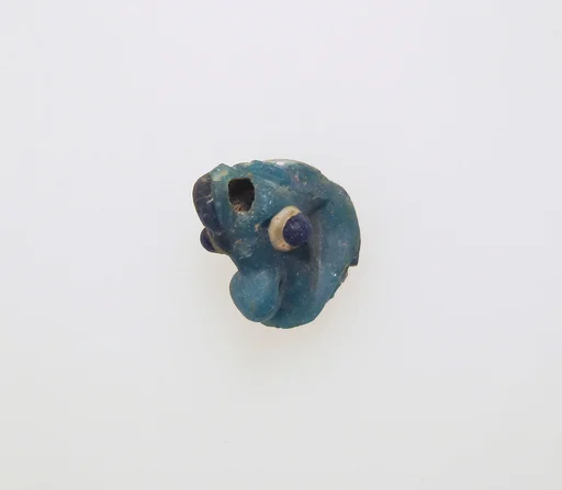 Glass pendant in the form of a demonic mask
