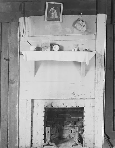 [Fireplace with Arrangement of Objects on Mantle in Floyd Burroughs' Home, Hale County, Alabama]