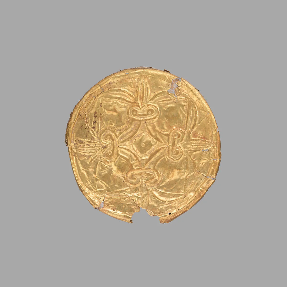 Gold roundel with stamped designs — Unknown
