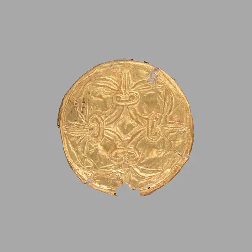 Gold roundel with stamped designs