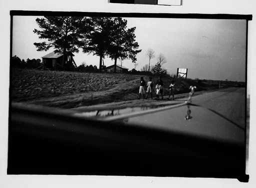 [Children Walking by Side of Road, From Moving Automobile, Macon, Georgia]