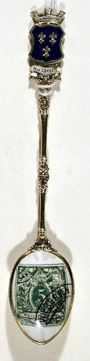 Souvenir spoon with green postage stamp and postmark for Wiesbaden