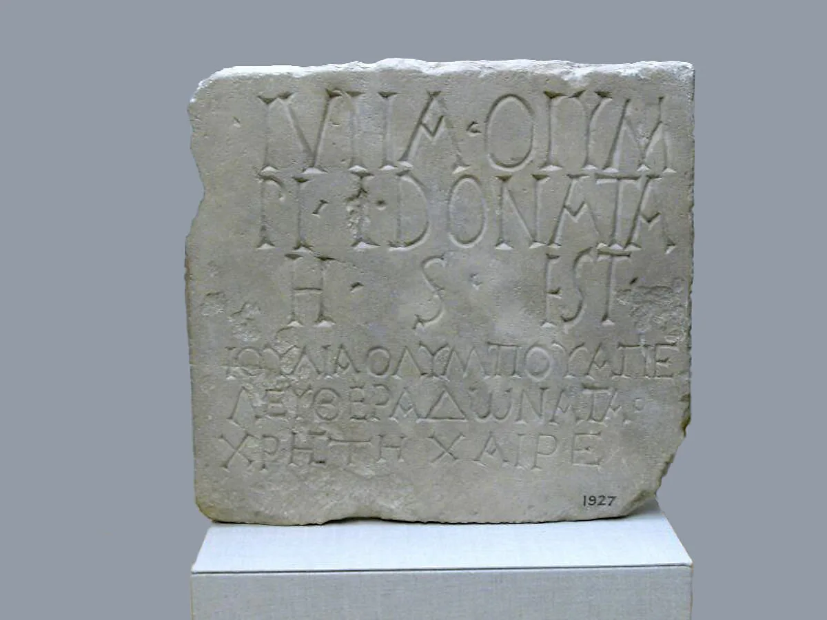 Limestone plaque with bilingual inscription — Unknown