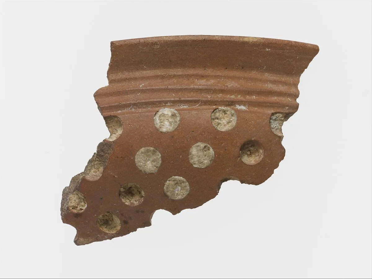 Terracotta rim fragment with white inlay — Unknown