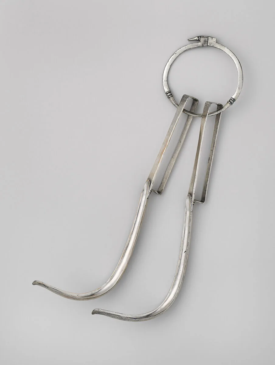 Pair of silver strigils (scrapers) on a carrying ring — Unknown