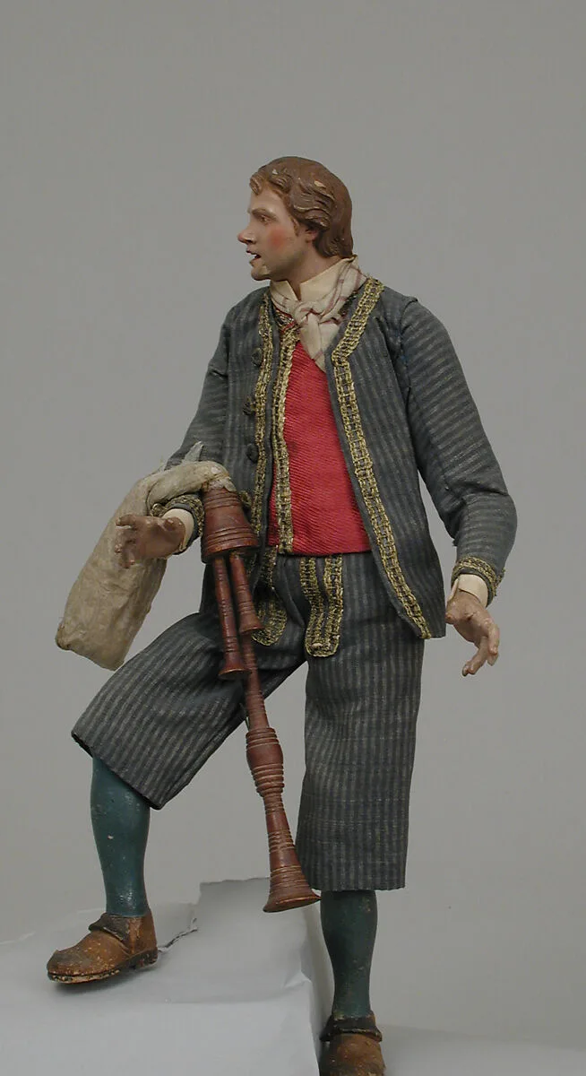 Young man in suit with bagpipes — Unknown
