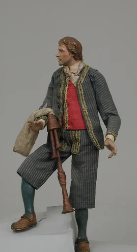 Young man in suit with bagpipes