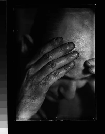 [Sam Loveman with Head in Hands]