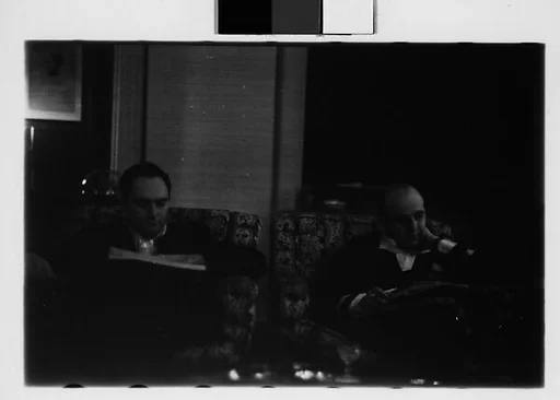 [Four 35mm Film Frames: Gifford Cochran and Unidentified Man in Library, Croton Falls, New York]