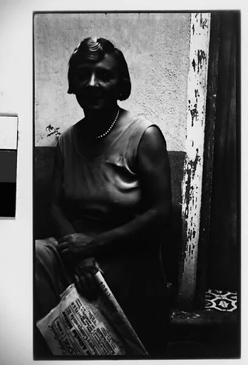 [Woman with Newspaper Seated in Courtyard, Havana]