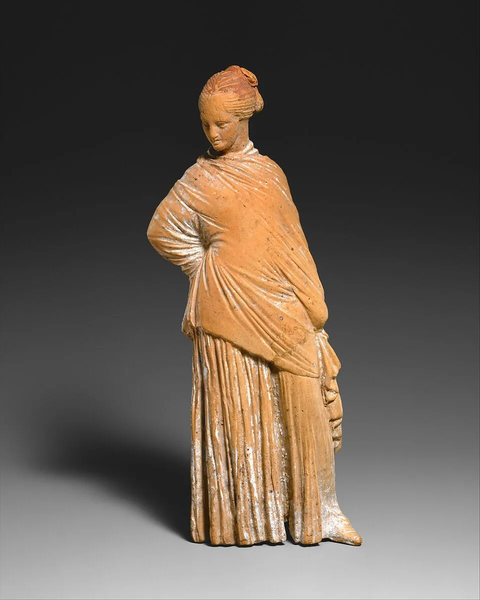 Terracotta statuette of a standing woman — Unknown