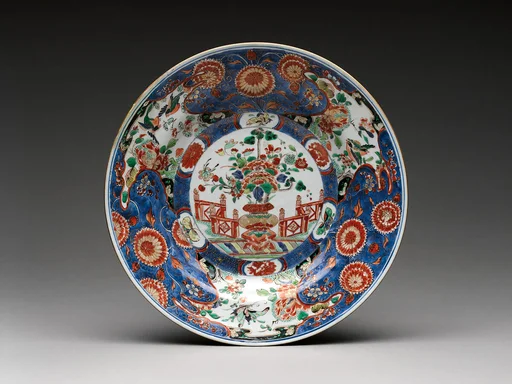 Dish with a vase of flowers