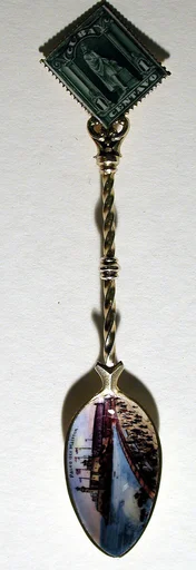 Souvenir spoon with view of the Paseo del Maleron and finial in form of a postage stamp
