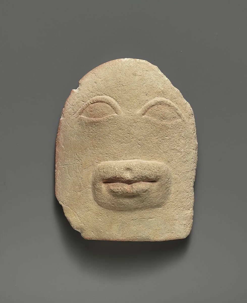 Limestone votive relief of eyes and a mouth — Unknown