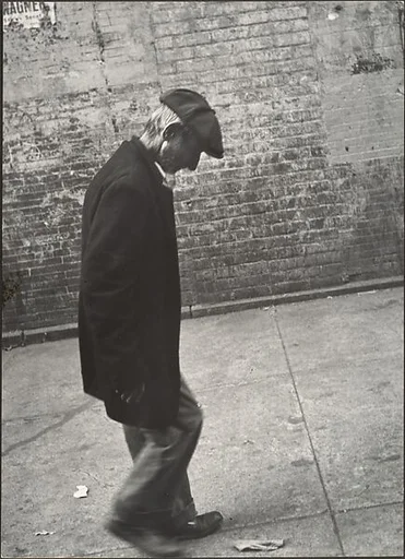 [Elderly Man in Dark Jacket and Cap Walking on Street, New York]