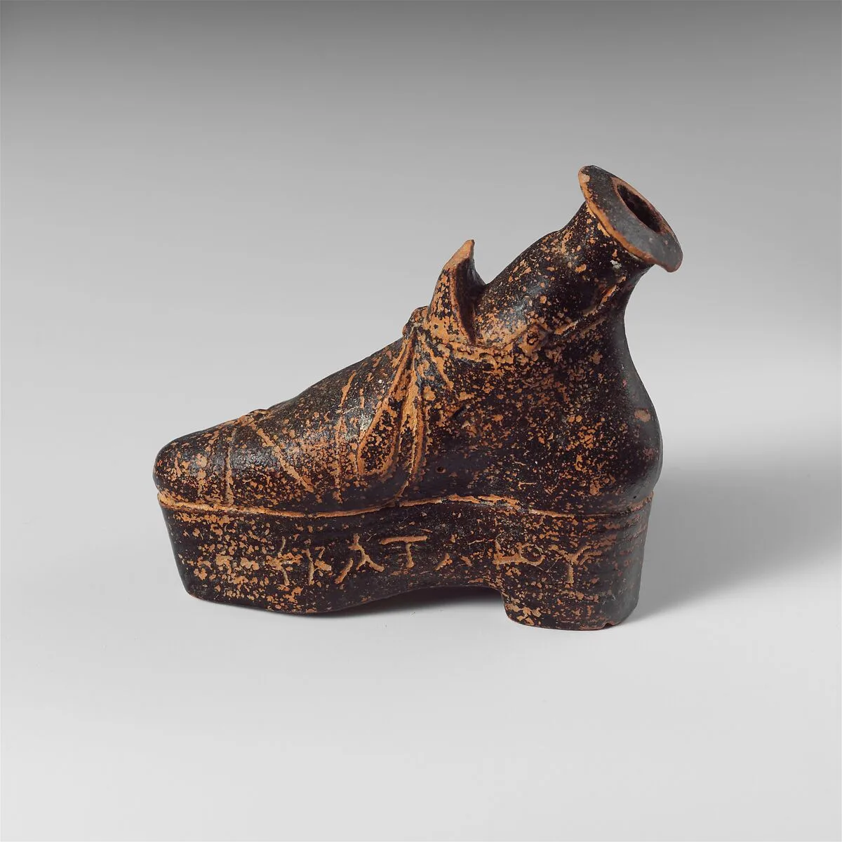 Terracotta perfume flask in the shape of a shoe — Unknown